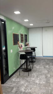 The same room with the wall recolored sage